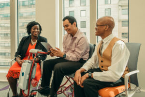 Three disabled people in a meeting